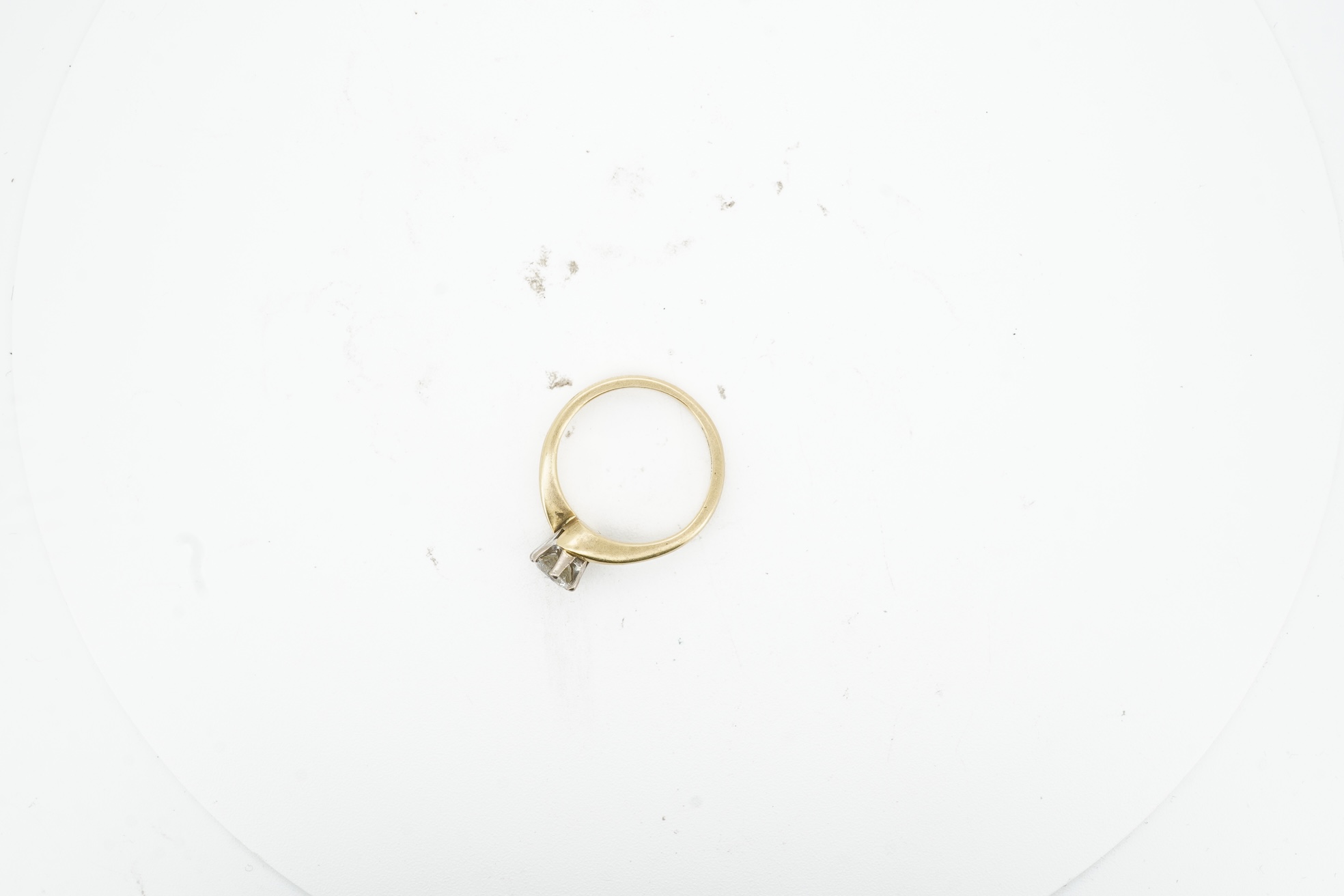 A diamond solitaire ring, claw-set with a brilliant-cut diamond weighing approximately 0.50 carats, to an symmetrical 18ct gold mount, size I, British hallmarks, gross weight approximately 3 grams